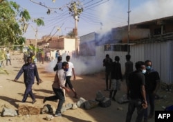 FILE - Sudanese protesters demonstrate against their government in the capital Khartoum's district of Burri, Feb. 24, 2019.