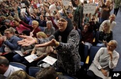 Noor Ul-Hasan reacts during Rep. Jason Chaffetz's town hall meeting at Brighton High School, in Cottonwood Heights, Utah, Feb. 9, 2017. In an echo of the raucous complaints that confronted Democrats back in 2009 as they worked to pass "Obamacare" in the first place, Republicans who want to repeal it now are facing angry pushback of their own at constituent gatherings from Utah to Michigan to Tennessee and elsewhere, even in solidly Republican districts.
