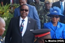 FILE - Malawi President-Elect Peter Mutharika and first lady Getrude Mutharika attend his swearing-in ceremony at Kamuzu Stadium in Bantyre.