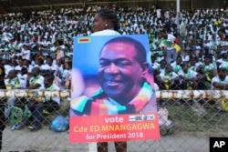 Supporters of Zimbabwean President Emmerson Mnangagwa attend a rally in Hwange about 700 kilometres south west of the capital Harare, June, 27, 2018.