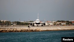 A British Airways plane is seen on the tarmac before taking off at the Gibraltar International airport, in Gibraltar, south of Spain, August 4, 2013. 