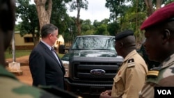 The U.S. Ambassador to Central African Republic Jeffrey Hawkins and the Central African Republic's deputy chief of staff for planning, Lieutenant Colonel Ishmael Koagu, check out a trucks being provided by the U.S. government to the C.A.R. army. (Z. Bad