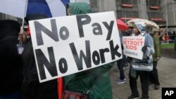 Detroit teachers march outside the district headquarters in Detroit, Michigan, May 2, 2016.