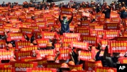 Members of the Korean Confederation of Trade Unions hold up their banners during a May Day rally in Seoul, South Korea, Wednesday, May 1, 2019. Thousands are marking May Day by marching through Asia's capitals and demanding better working conditions and expanding labor rights.