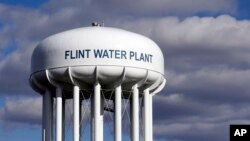 FILE - The Flint Water Plant water tower is seen in Flint, Michigan, March 21, 2016. 