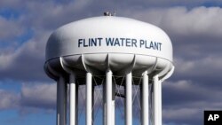 FILE - The Flint Water Plant water tower is seen in Flint, Michigan, March 21, 2016. 