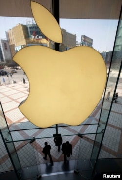 FILE - Apple Inc's logo is seen at its Apple store in Beijing, China.