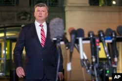 Attorney Kevin Downing walks to the microphones to speak with reporters following the sentencing of his client, former Trump campaign chairman Paul Manafort, in Alexandria, Va., March 7, 2019. Manafort was sentenced to nearly four years in prison for tax and bank fraud related to his work advising Ukrainian politicians.
