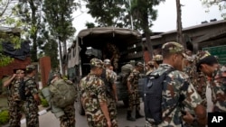 Nepalese army soldiers prepare to leave for a rescue mission to the site where the suspected wreckage of a U.S. Marine helicopter, that disappeared earlier this week while on a relief mission in the earthquake-hit Himalayan nation, was spotted, in Kathman