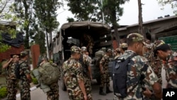 Nepalese army soldiers prepare to leave for the suspected crash site of a U.S. Marine helicopter. It disappeared earlier this week while on a relief mission in the quake-hit Himalayan nation. 