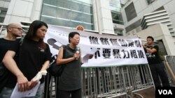 FILE - Hong Kong journalists protest suppression by mainland authorities in 2012.