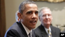Senate Minority Leader Mitch McConnell of Ky. looks on at right, as President Barack Obama meets with Congressional leaders regarding the debt ceiling, Wednesday, July 13, 2011, in the White House in Washington.