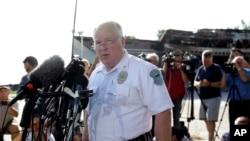 FILE - Ferguson Police Chief Thomas Jackson releases the name of the the officer accused of fatally shooting an unarmed black teenager Friday, Aug. 15, 2014.