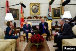 FILE - U.S. President Donald Trump speaks next to Vice President Mike Pence (2ndL) while meeting with Senate Democratic Leader Chuck Schumer (D-NY) and House Democratic Leader Nancy Pelosi (D-CA) at the White House in Washington, Dec. 11, 2018.