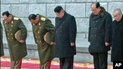 North Korea's new leader Kim Jong Un (C) bows during the funeral of late North Korean leader Kim Jong Il in this still image taken from video, in Pyongyang, December 28, 2011.