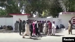 Relatives of a wedding party victims wait outside the emergency hospital in Helmand, Afghanistan September 23, 2019, in this still image taken from a video. Reuters TV via REUTERS