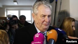 Milos Zeman talks to media after casting his vote in presidential elections at a polling station in Prague, Jan. 11, 2013.