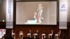 U.S. Secretary of Treasury Steven Mnuchin, right, on podium, delivers a speech during the G20 Ministerial Symposium on International Taxation in the G20 Finance Ministers and Central Bank Governors meeting in Fukuoka, Japan, June 8, 2019. 