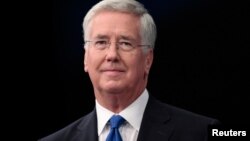 FILE - Britain's Defense Secretary Michael Fallon arrives to address the Conservative Party Conference in Manchester, Britain, Oct. 4, 2015. 