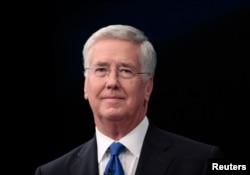 Britain's Defense Secretary Michael Fallon arrives to address the Conservative Party Conference in Manchester, Britain, Oct. 4, 2015.