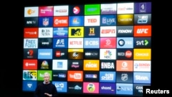 FILE - Apple CEO Tim Cook speaks about the Apple TV during an event at Apple headquarters in Cupertino, California, March 21, 2016. 