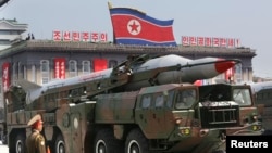 FILE - A North Korean missile is carried by a military vehicle during a parade in Pyongyang.