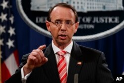 Deputy Attorney General Rod Rosenstein speaks during a news conference at the Department of Justice, July 13, 2018, in Washington.