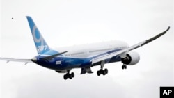 The Boeing 787-9 in flight, Tuesday, Sept. 17, 2013, at Paine Field in Everett, Washington. 