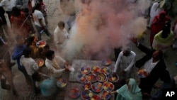 Pakistani Hindus celebrate Holi, festival of colors in Lahore, Pakistan, in 2012. The Hindus who got alcohol poisoning consumed the hooch during preparations for Holi celebrations, which will begin Wednesday.