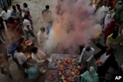 FILE - Pakistani Hindus celebrate Holi, festival of colors in Lahore, Pakistan, March 8, 2012.