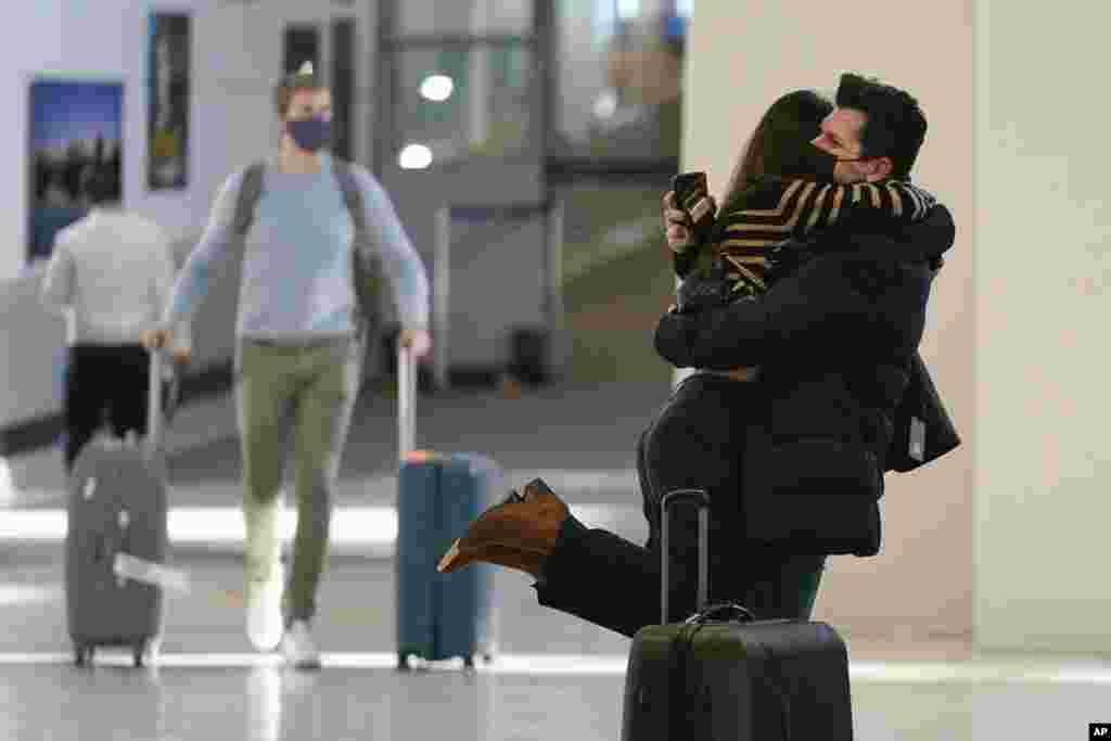 Natalia Abrahao is greeted by her fiancé Mark Ogertsehnig at Newark Liberty International Airport in Newark, New Jersey, Nov. 8, 2021.