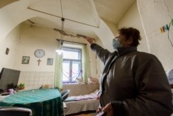 Ankica Loncarevic shows damages in her home after a 5.2 magnitude earthquake in Petrinja, Croatia, December 28, 2020. REUTERS/Antonio Bronic