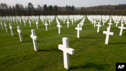 FILE - A view of the rows of crosses of American World War I soldiers at the Meuse-Argonne American cemetery in Romagne-sous-Montfaucon, March 24, 2017. It was America's largest and deadliest battle, with 26,000 U.S. soldiers killed and tens of thousands wounded. 