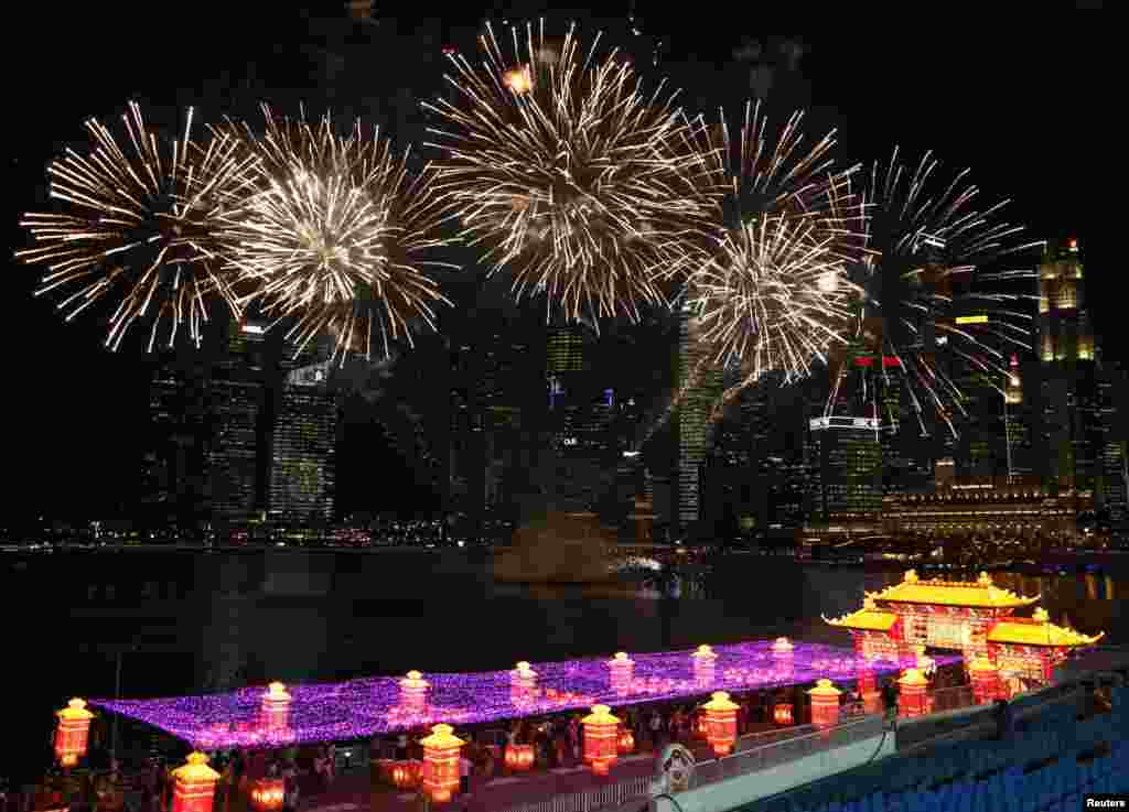 Fireworks explode in the skyline of the city during Chinese New Year celebrations at the Marina Bay in Singapore.