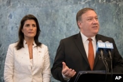 FILE - U.S. Secretary of State Mike Pompeo, with U.S. Ambassador to the United Nations Nikki Haley, speaks to reporters at U.N. headquarters, July 20, 2018.