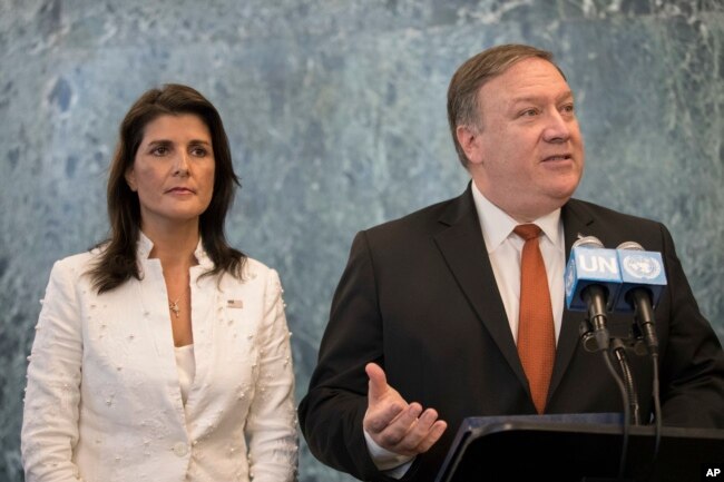 FILE - U.S. Secretary of State Mike Pompeo, with U.S. Ambassador to the United Nations Nikki Haley, speaks to reporters at U.N. headquarters, July 20, 2018.