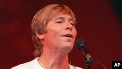 FILE--John Denver is shown performing in Moscow, July 1, 1985.
