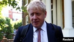 FILE - Former British Foreign Secretary Boris Johnson, who is running to succeed Theresa May as prime minister, leaves his home in London, May 30, 2019.