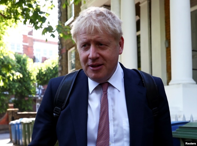 FILE - Former British Foreign Secretary Boris Johnson, who is running to succeed Theresa May as prime minister, leaves his home in London, May 30, 2019.