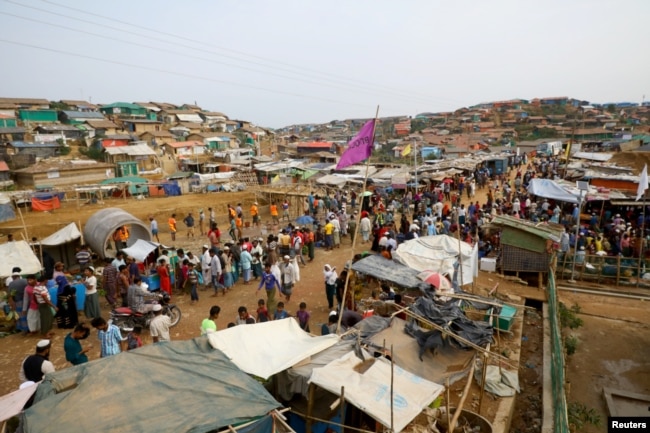 Rohingya refugees gather at a market inside a refugee camp in Cox's Bazar, Bangladesh, March 7, 2019.