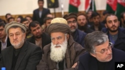 Former Afghan warlord Abdul Rasool Sayyaf, center, attends the inauguration of the Afghanistan Protection and Stability Council in Kabul, Afghanistan, Friday, Dec. 18, 2015. 
