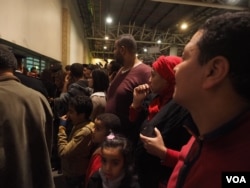Families and relatives of passengers on the hijacked flight waiting at Cairo airport, Tuesday, March 28, 2016. (H. Elrasam/VOA)