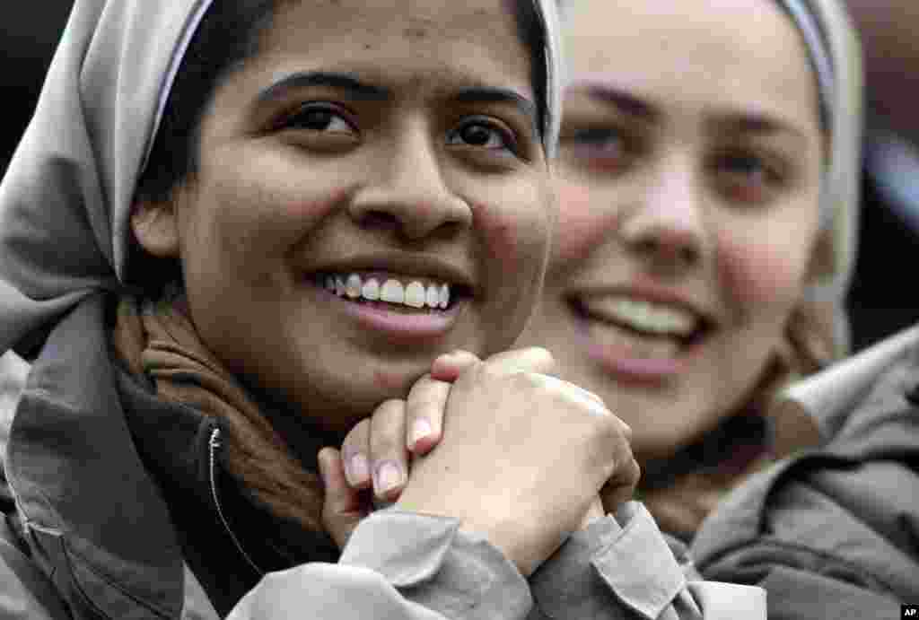 Two nuns smile in Saint Peter&#39;s Square at the Vatican, March 13, 2013. 