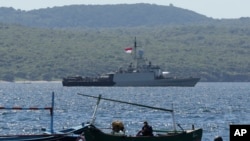 Indonesian Navy ship KRI Singa sails to take part in the search for submarine KRI Nanggala that went missing while participating in a training exercise on Wednesday, off Banyuwangi, East Java, Indonesia, Thursday, April 22, 2021. (AP Photo)