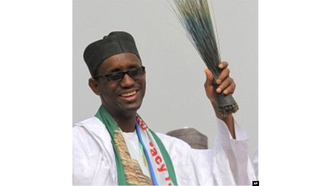 Former anti-graft chief and presidential flagbearer Nuhu Ribadu with a broom, a party symbol, reacts after his announcement as a consensus candidate during the presidential primaries of Action Congress of Nigeria (ACN) in Lagos (File Photo)