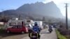 French Gendarmes patrol a street o where mobile-homes parked, on December 20, 2012, in the French southwestern village of Bugarach.