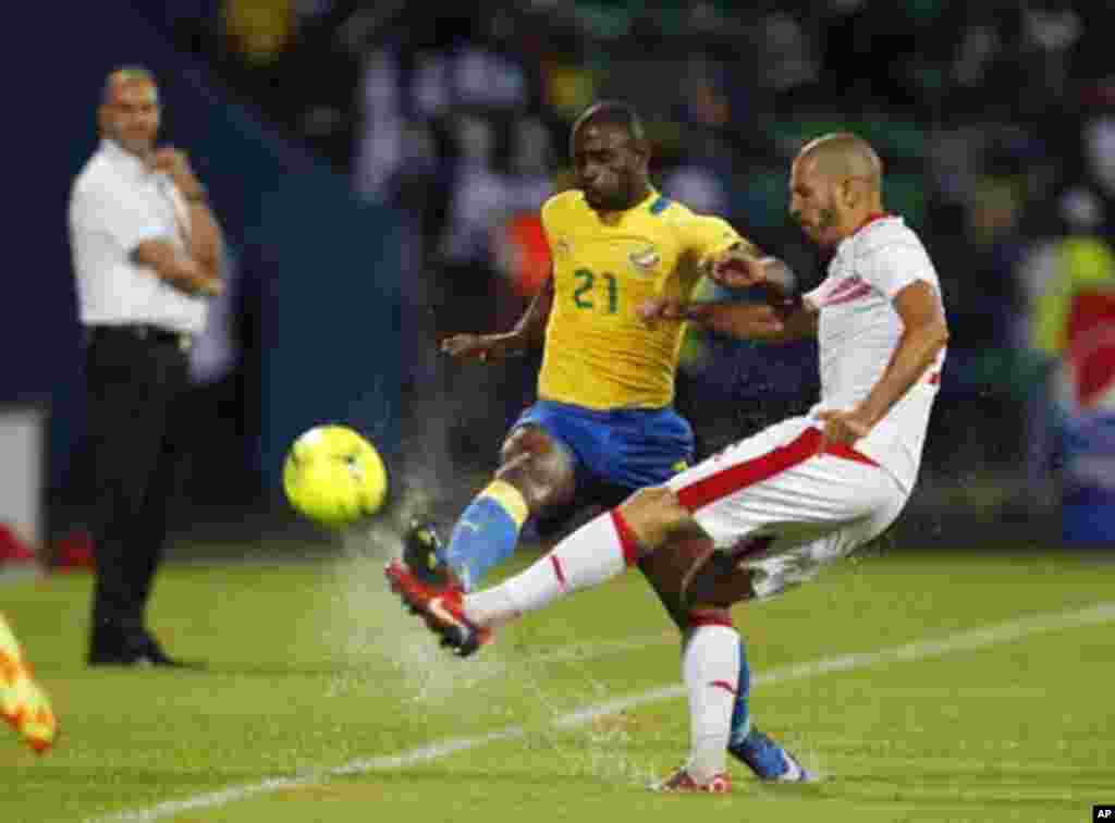 Gabon's Roguy Meye (L) challenges Aymen Abdennour of Tunisia during their African Cup of Nations Group C soccer match at Franceville stadium in Gabon January 31, 2012.