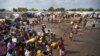 Hundreds of internally displaced persons (IDP) at a U.N. camp in Juba gather around a truck carrying clean water. Part of the $133 million pledged by the United States for South Sudan on June 16, 2015, will be used to provide water and sanitation to IDPs and refugees.