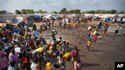 Hundreds of internally displaced persons (IDP) at a U.N. camp in Juba gather around a truck carrying clean water. Part of the $133 million pledged by the United States for South Sudan on June 16, 2015, will be used to provide water and sanitation to IDPs and refugees.