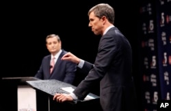 FILE - Republican U.S. Senator Ted Cruz, left, and Democratic U.S. Representative Beto O'Rourke take part in their first debate for the Texas U.S. Senate in Dallas, Sept. 21, 2018.